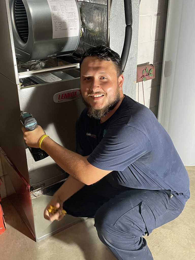 Caddo technician installing a furnace air handler